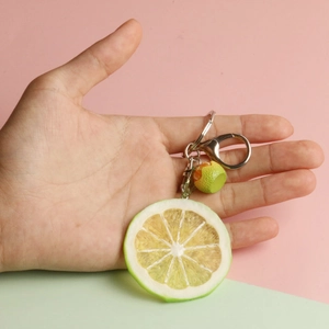 Handheld realistic lime slice keychain with detailed resin pulp and silver metal ring