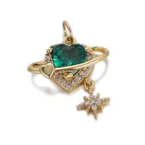 Detail of gold heart pendant with green gemstone and small star charm accessories