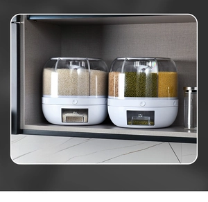 Close-up of a rotating cereal dispenser showing multi-compartment storage in a kitchen cabinet