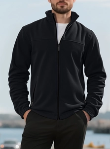 Close-up of thick black fleece texture and zipper detail on men's stand-up collar jacket