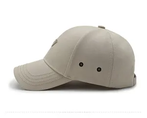 Side view of beige baseball cap featuring high-performance twill fabric and metal eyelets