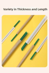 Individual paper wrapped green plastic straws in various diameters and lengths for drinks