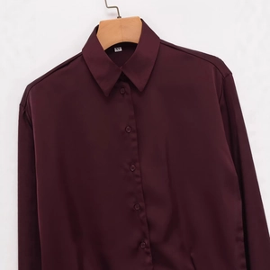 Elegant deep red satin long sleeve button-up shirt in a stylish balloon silhouette