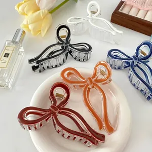 Elegant jelly-colored bow hair claws in various vibrant colors for a chic hairstyle