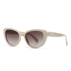 Beige cat-eye sunglasses with rhinestone edges and brown gradient lenses for women