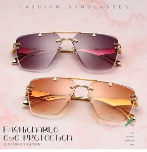 Detail of rimless metal sunglasses with purple-pink and orange-yellow gradient lenses