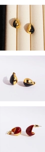 Detail of red enamel teardrop earrings and black-gold geometric minimalist studs
