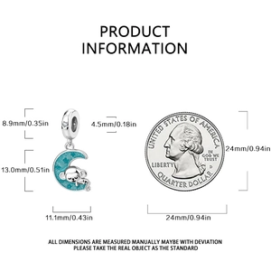 Detailed product size guide for monkey and moon charm with coin scale comparison