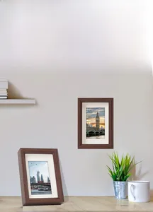 Detail of minimalist walnut wood photo frame showing wall hanging and tabletop display options