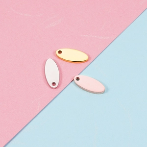 Set of three oval stainless steel blank tags in gold, silver, and rose gold finishes