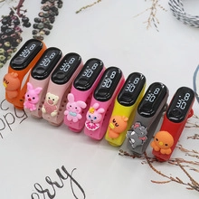 Macro view of eight colorful LED digital watches with 3D silicone cartoon characters