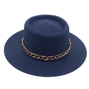 Detailed close-up of navy blue boater hat with stylish gold metal chain decoration