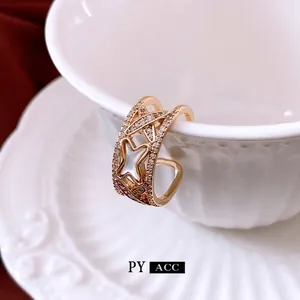 Elegant 18K gold star ring with pavé zircon and mother of pearl inlay on ceramic edge