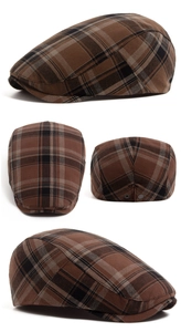 Detail view of brown plaid flat cap featuring adjustable metal buckle and vintage pattern