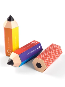 Top view of creative pencil-shaped candy gift boxes with colorful patterns and greetings