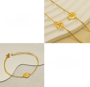 Macro detail of gold titanium steel hollow alphabet bracelets with A, B, and C charms