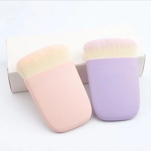 Flat fiber powder makeup brushes in pink and purple with portable rectangular handles