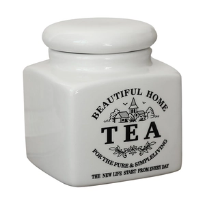 White minimalist ceramic tea storage jar with black TEA text and decorative lid