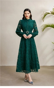 Detail view of lace texture and waist belt with golden ring on green dress