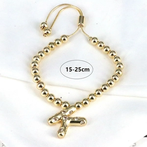 Adjustable gold beaded bracelet featuring a sparkling zircon initial K pendant charm