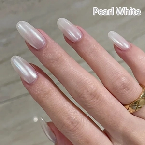 Close-up of oval pearl white chrome nails with soft iridescent shimmer and mirror finish