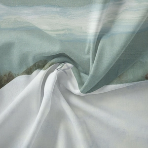 Close-up of bohemian wall tapestry fabric showing soft abstract watercolor textures