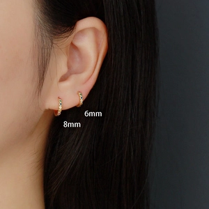 S925 sterling silver rainbow huggie earrings in 6mm and 8mm sizes on model