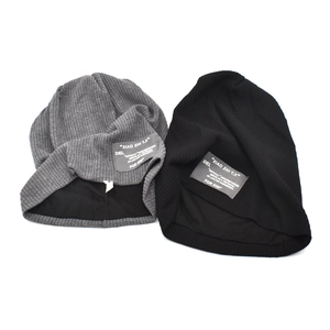 Winter knitted beanie set in black and dark grey with stylish fabric patch labels
