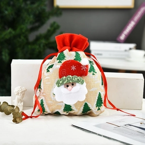 Christmas gift bag in red linen with Santa Claus motif and festive drawstring closure