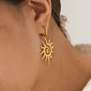 18K gold stainless steel sun earrings with hammered texture shown on model