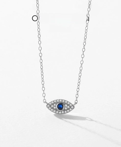 Macro shot of S925 sterling silver evil eye pendant with pavé cubic zirconia