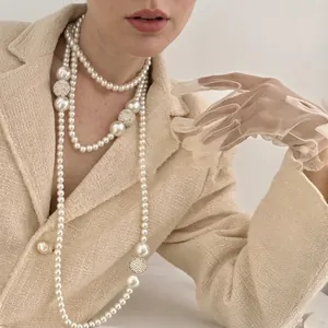 Elegant multi-layer pearl necklace with sparkling diamond-encrusted balls for women