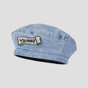 Close-up of the vintage light blue denim beret with #DG FAMILY embroidered patch detail
