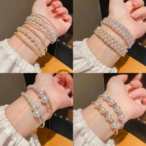 French style multi-layer pearl and rhinestone bracelet set in gold and silver finish