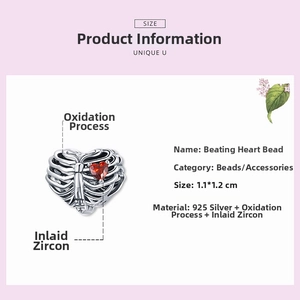 Detailed view of S925 silver rib cage charm with a red heart-shaped zircon inlay
