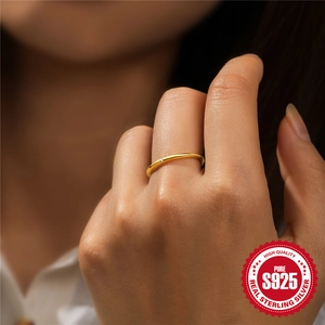 Minimalist 18K gold S925 silver thin ring with a small round zircon on a finger