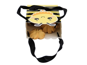Detail of bee themed candy box with black silk handle and cookies inside