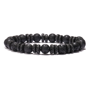 Detail of natural volcanic rock beads with tiger eye stones on a minimalist woven bracelet