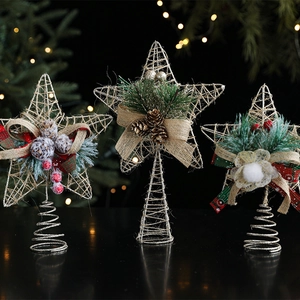 Golden iron wire Christmas tree star topper set with festive pine cones and red berries
