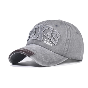 Distressed grey cotton baseball cap with TEXAS embroidery and brown leather brim detail