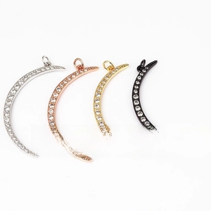 Detailed view of crescent moon pendants in silver, rose gold, gold, and black metal colors