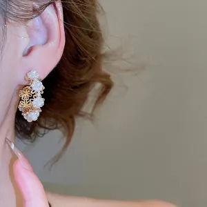 French vintage style round hoop earrings with hollow gold flowers and elegant white pearls