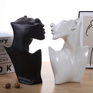 Artistic resin bust mannequin jewelry displays in black and white for necklace showing