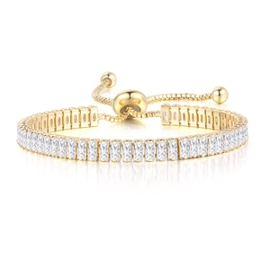 Macro detail of gold tennis bracelet featuring rectangular zircons and adjustable drawstring