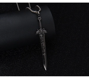 Detailed close-up of a vintage silver sword pendant with intricate lion king engravings