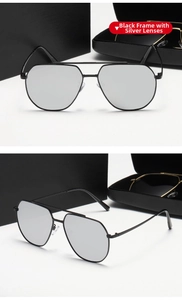 Detalle de gafas de sol de piloto con montura negra y cristales de espejo plateados