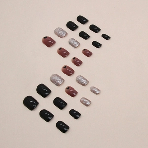Short black heart press-on nails with silver glitter and gradient design for women