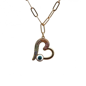 Gold paperclip necklace with rainbow zircon heart and blue evil eye pendant on white background