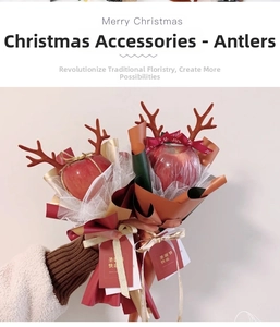 Detail of red Christmas reindeer antlers used for DIY holiday apple gift packaging decorations