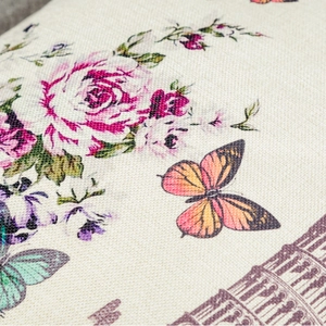 Macro detail of elephant tote bag fabric with floral roses and butterfly prints